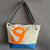 Maud Petit - Sac bandoulière en voile de bateau recyclée - Fabrication artisanale à La Ciotat, France - Éthique et durable en voile de bateau made in france