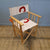 Wooden armchair and recycled boat sail made in france