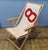 Wooden deckchair and sail recycled into boat sail made in france